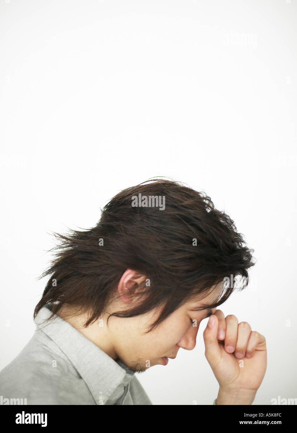 Young man in depressed mood Stock Photo