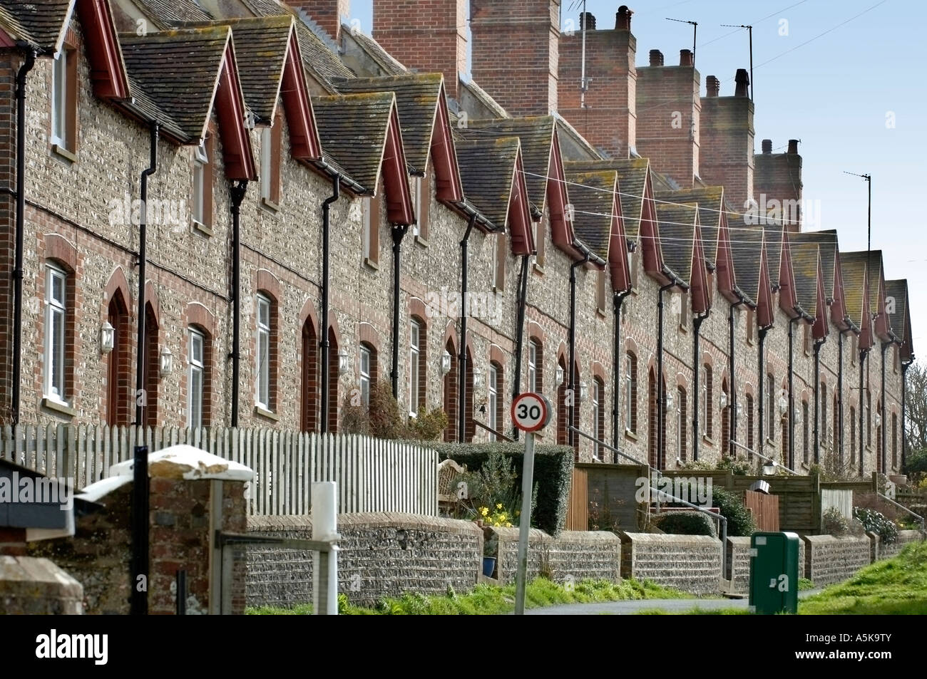 A row of flint fronted terraced houses in Glynde East Sussex Stock Photo