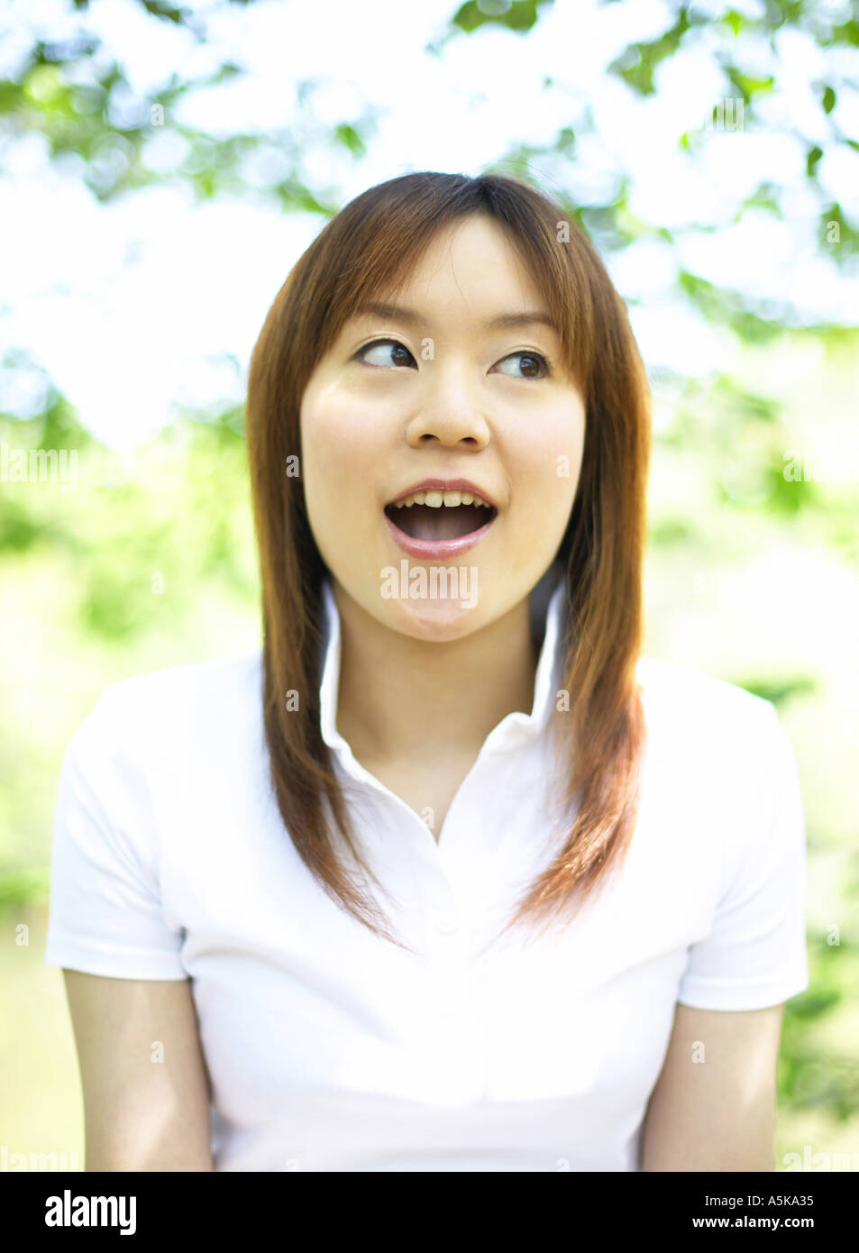 Young woman looking sideway Stock Photo