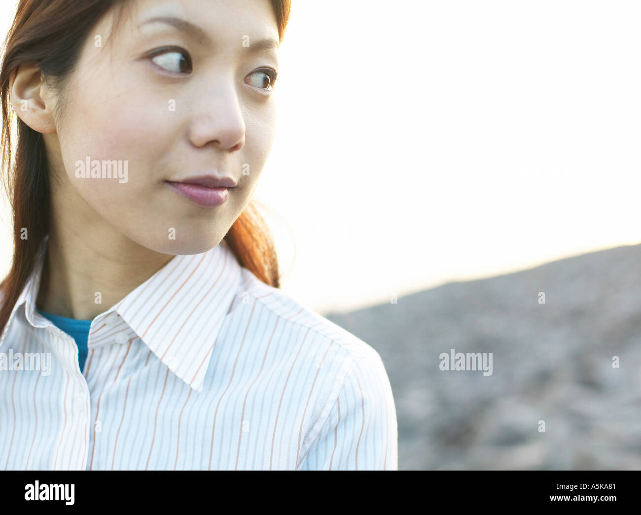 Young woman looking sideways Stock Photo