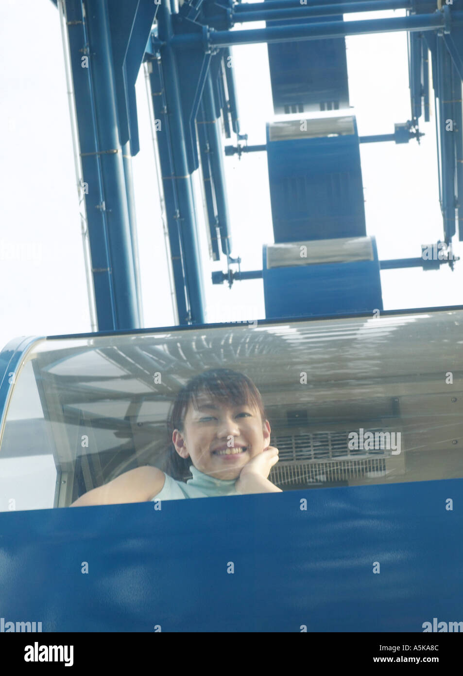 Woman riding ferris wheel hi-res stock photography and images - Alamy