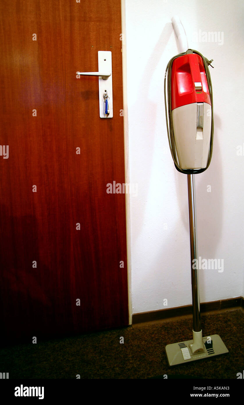 Vacuum cleaner of the 60s beside a door Stock Photo Alamy