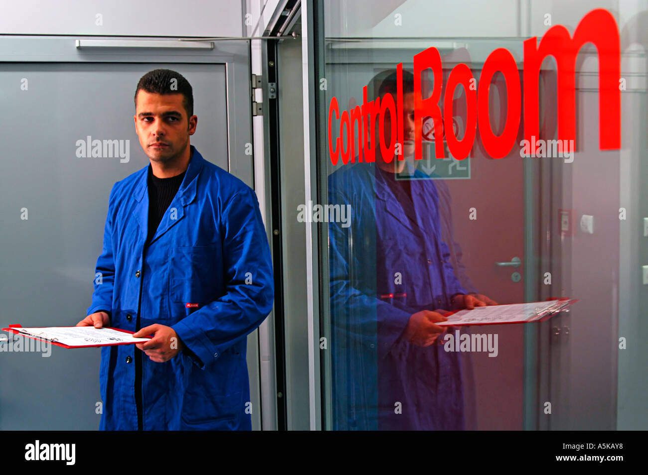 A Scientist is standing infront of the Control Room of the Artificial Climate Wind Channel, RTA Rail Tec Arsenal, Vienna Stock Photo
