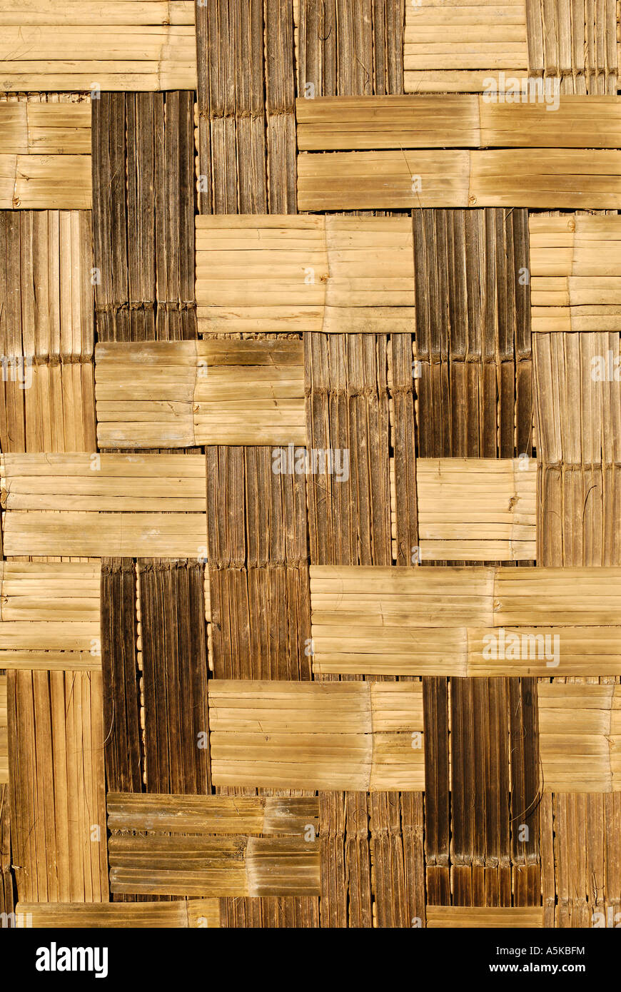 Woven bamboo mat as exterior wall of a house, Katchin State, Myanmar Stock Photo