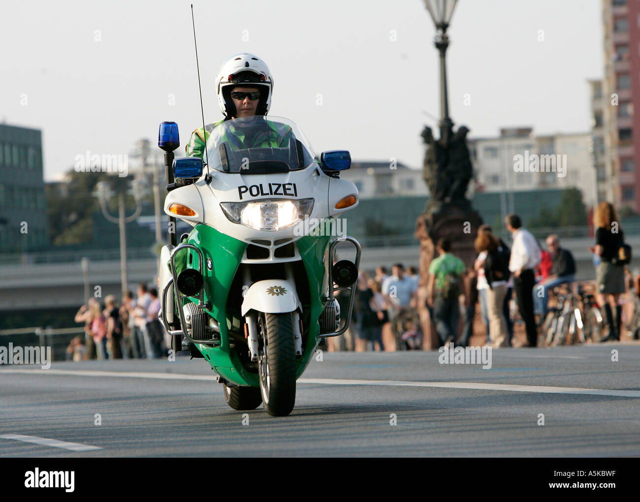 Police motorcyclist patrols on the road Stock Photo