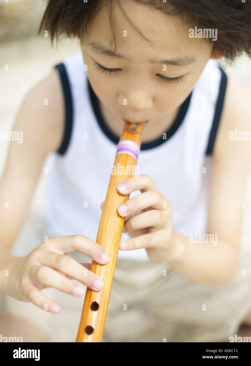 Young Child playing flute Stock Photo Alamy