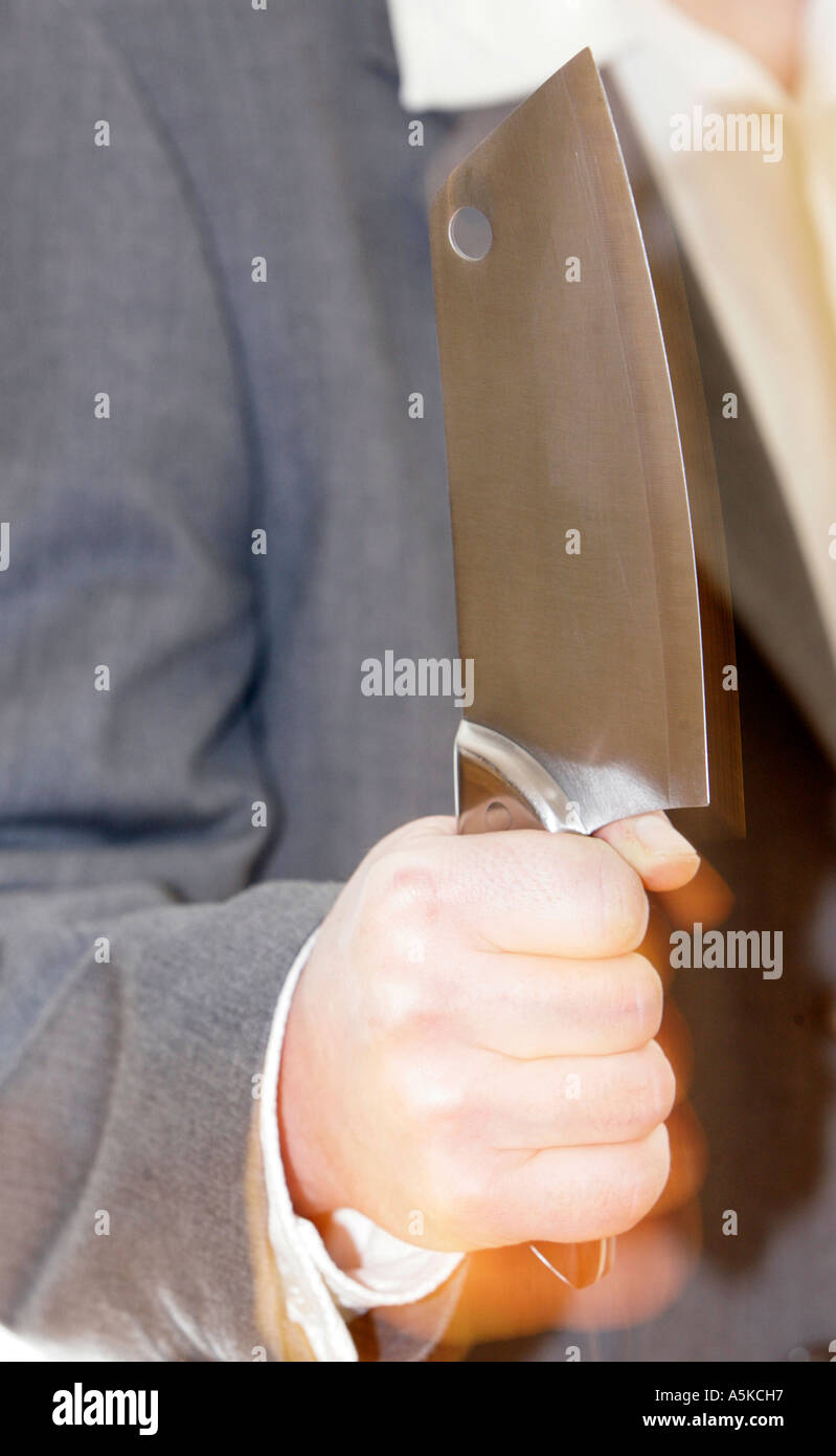 Butchers knife in the hand and ready to rumble Stock Photo Alamy