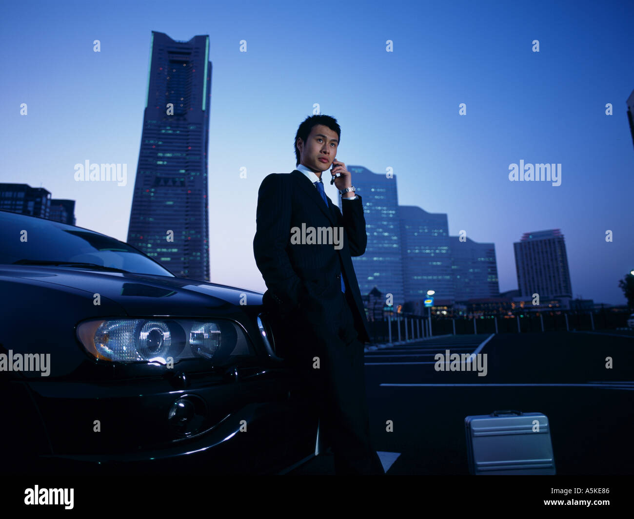 Asian Man talking on a cell phone Stock Photo