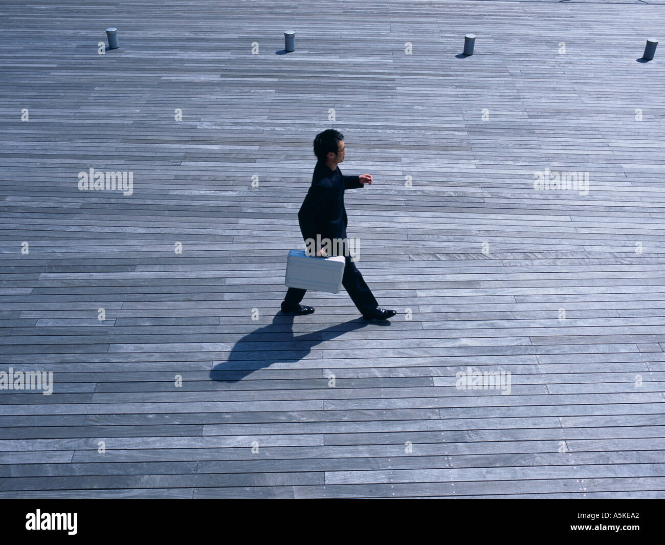 Aerial view of a man walking on a bridge Stock Photo - Alamy