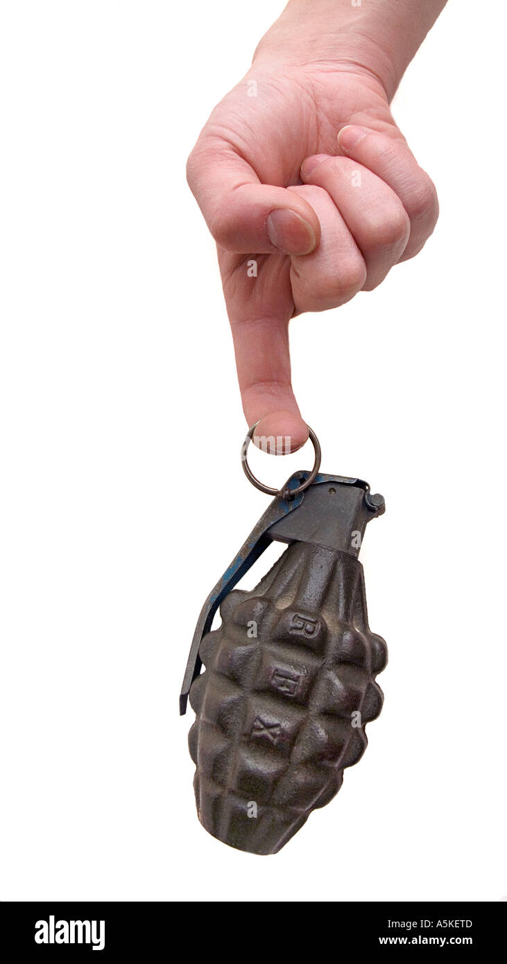 Hand grasping a hand grenade Familiar pineapple form M21 grenade Finger