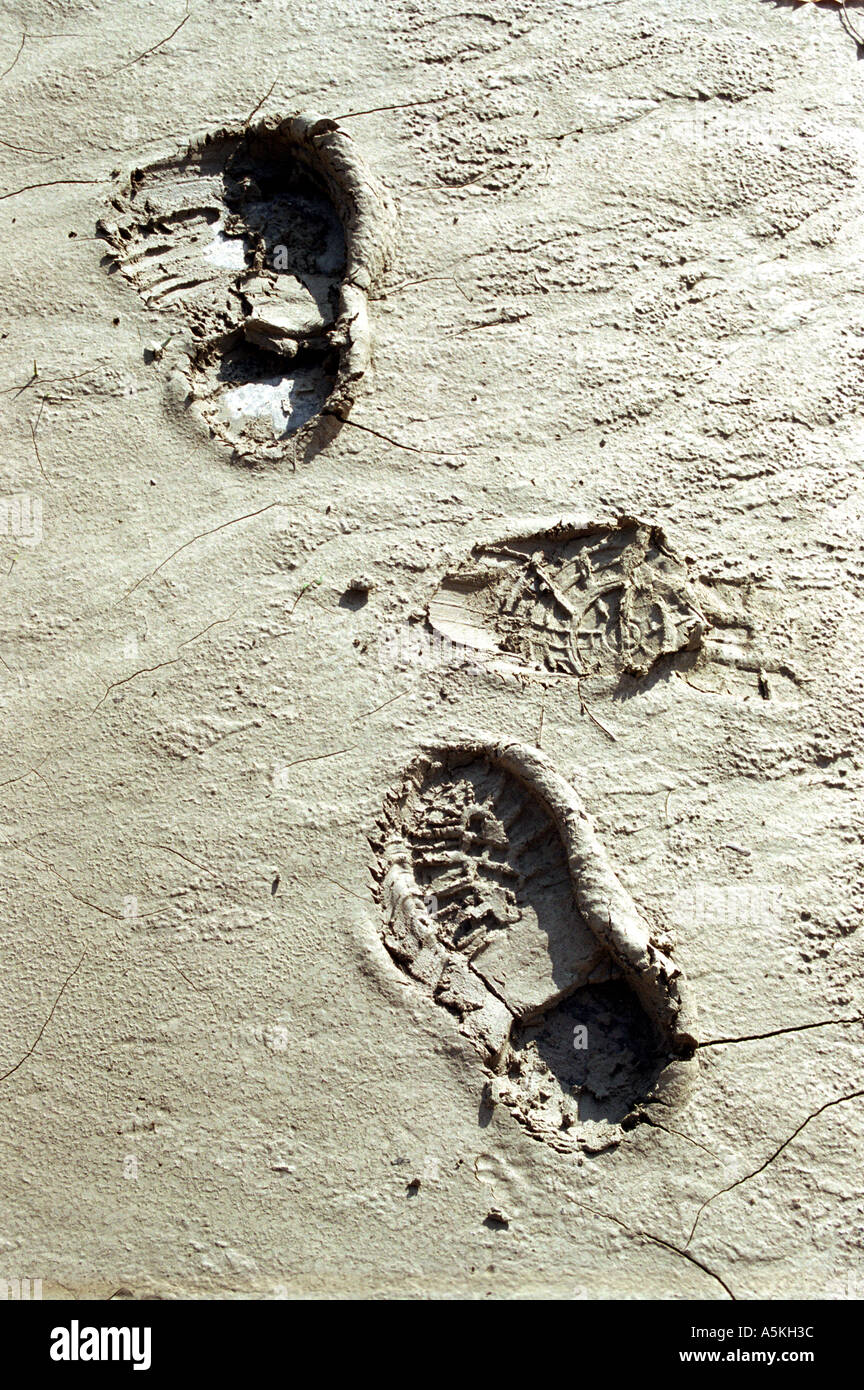 two footsteps in sand mud Stock Photo - Alamy