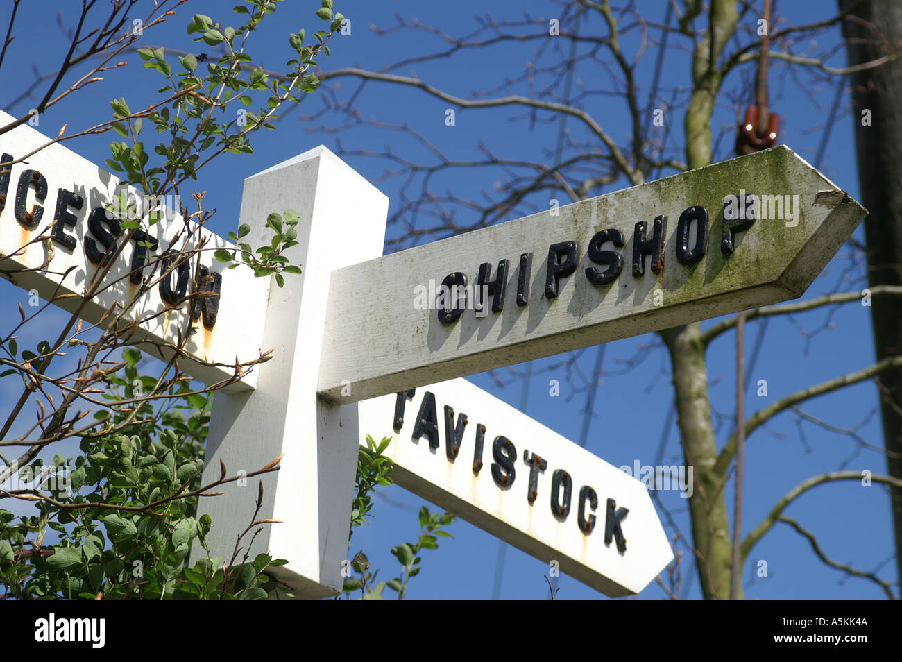Signpost to Launceston Tavistock and Chipshop Road sign Devon England Great Britain United Kingdom GB UK Stock Photo
