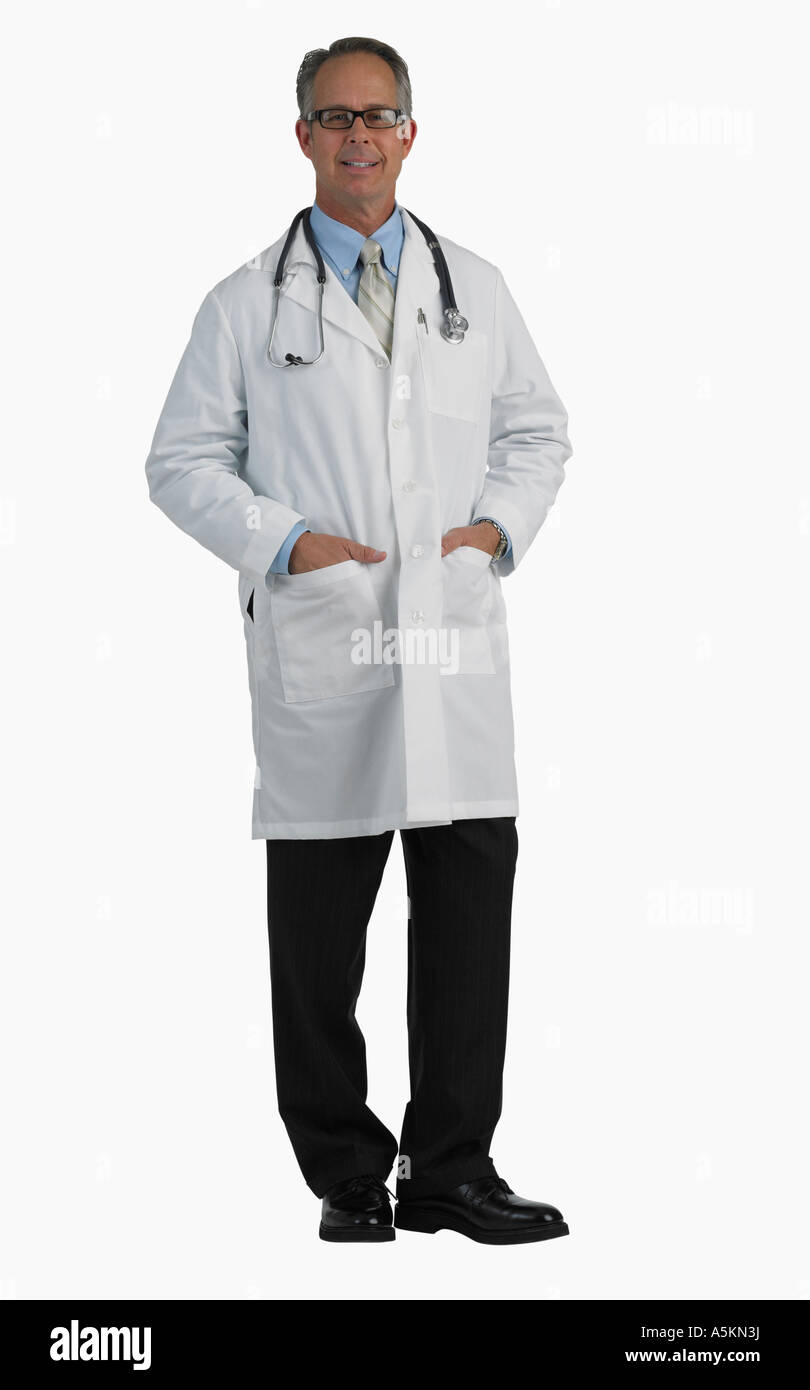 Studio shot of male doctor with hands in pockets Stock Photo