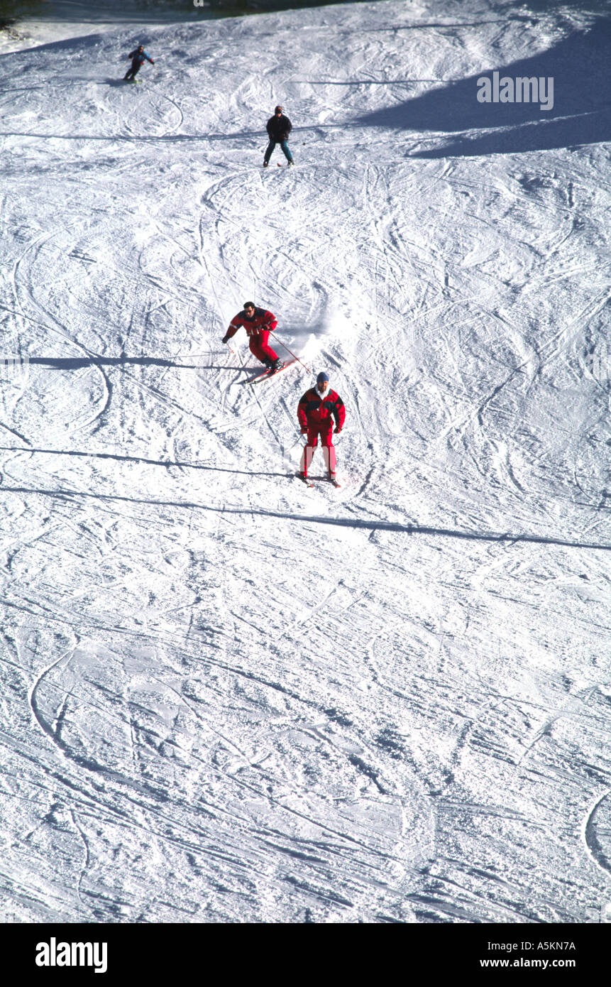 Skiers on a piste, Piemonte, Italy Stock Photo
