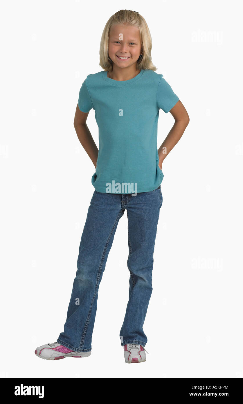 Studio shot of girl with hands in back pockets Stock Photo - Alamy