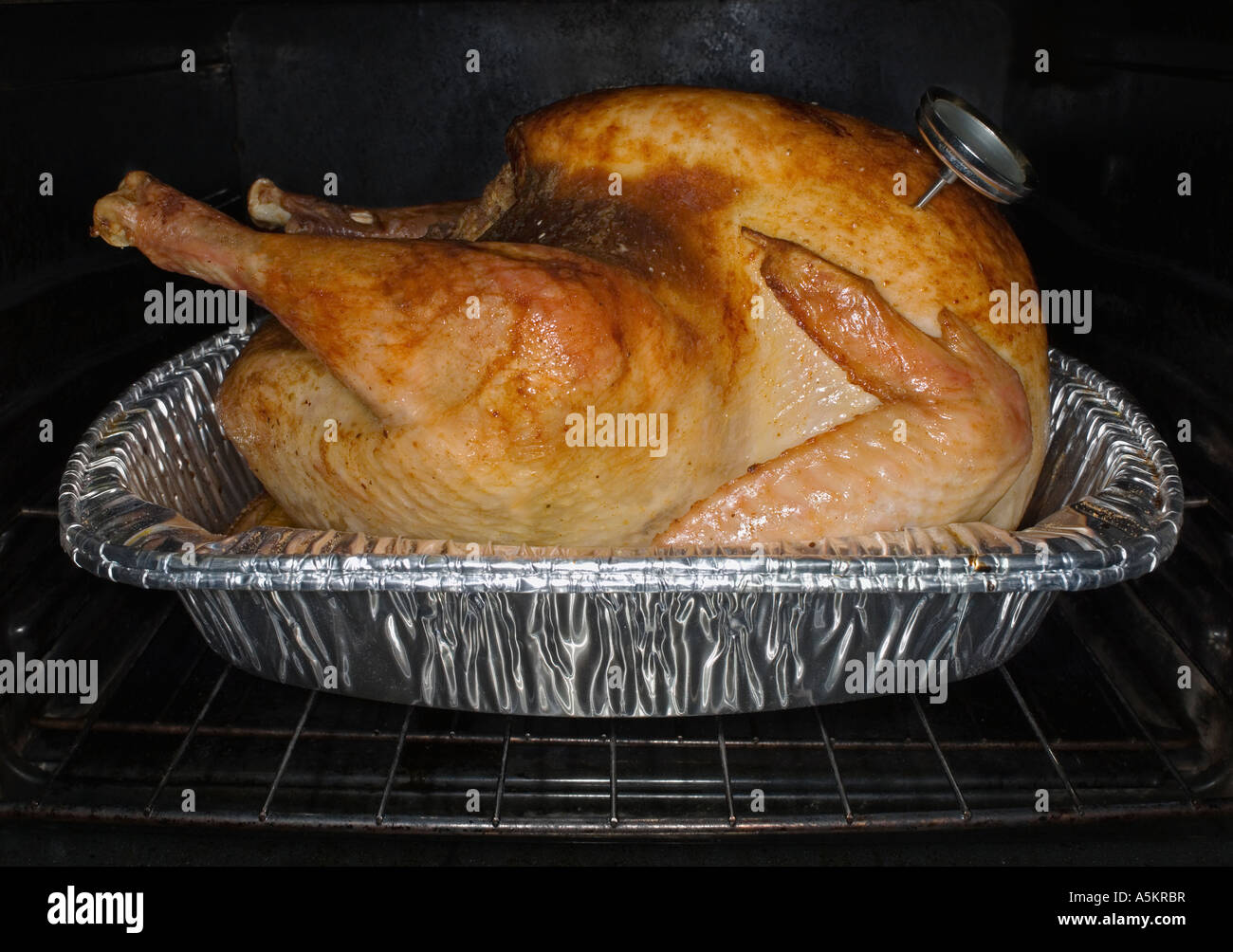 Turkey roasting in oven Stock Photo Alamy