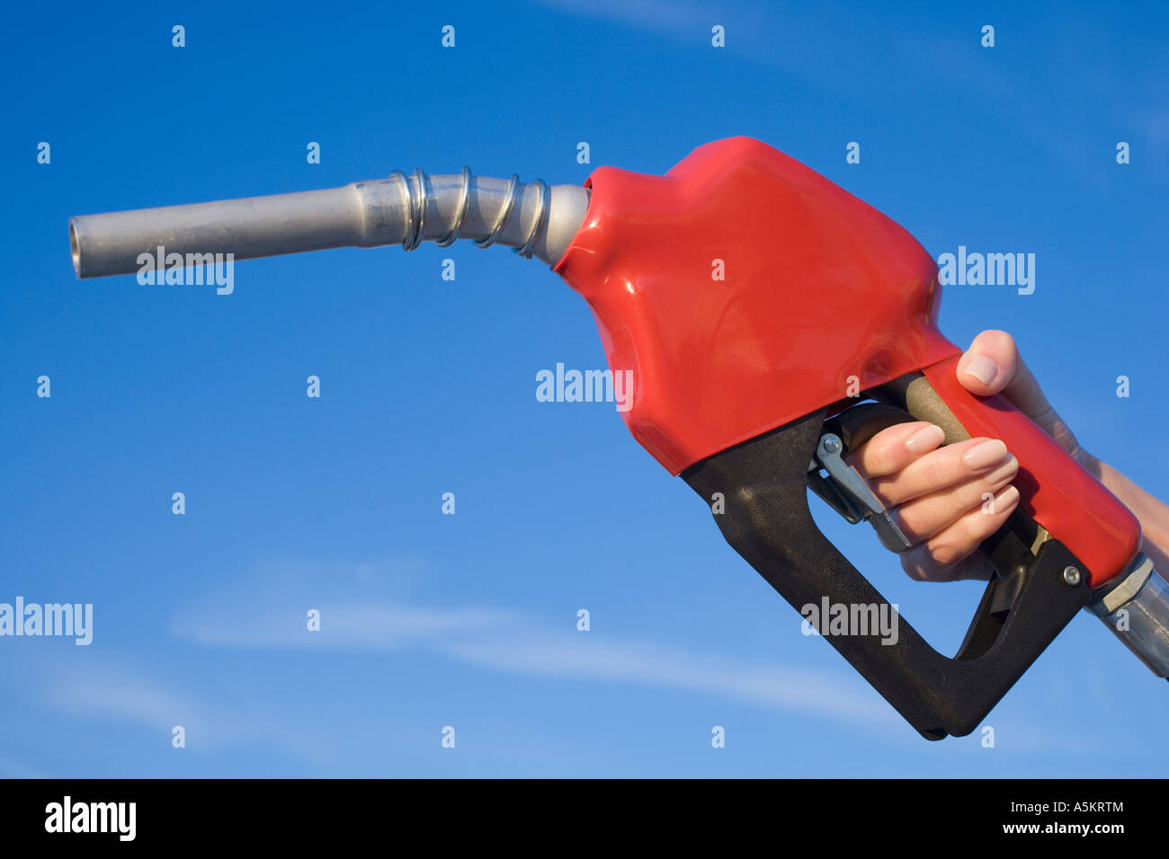 Woman holding gas pump nozzle Stock Photo Alamy