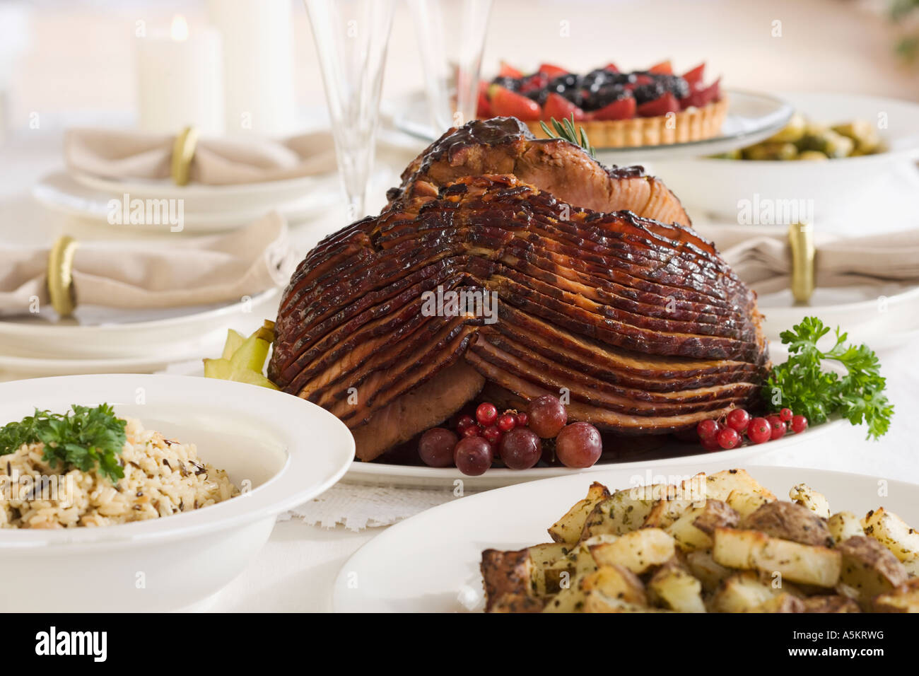 Spiral ham and side dishes on set table Stock Photo Alamy