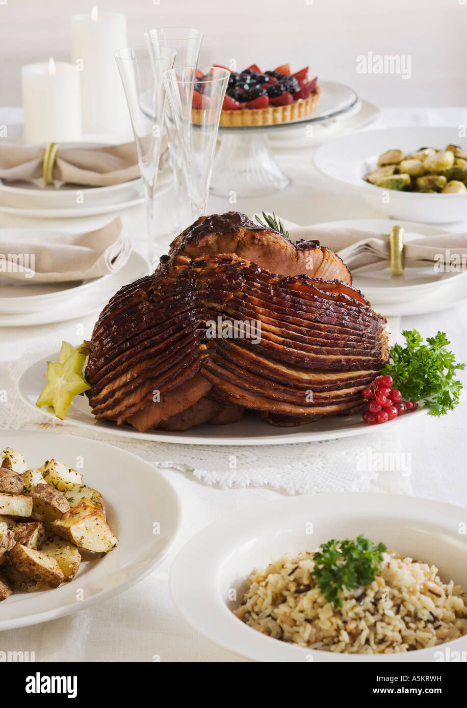 Spiral ham and side dishes on set table Stock Photo Alamy