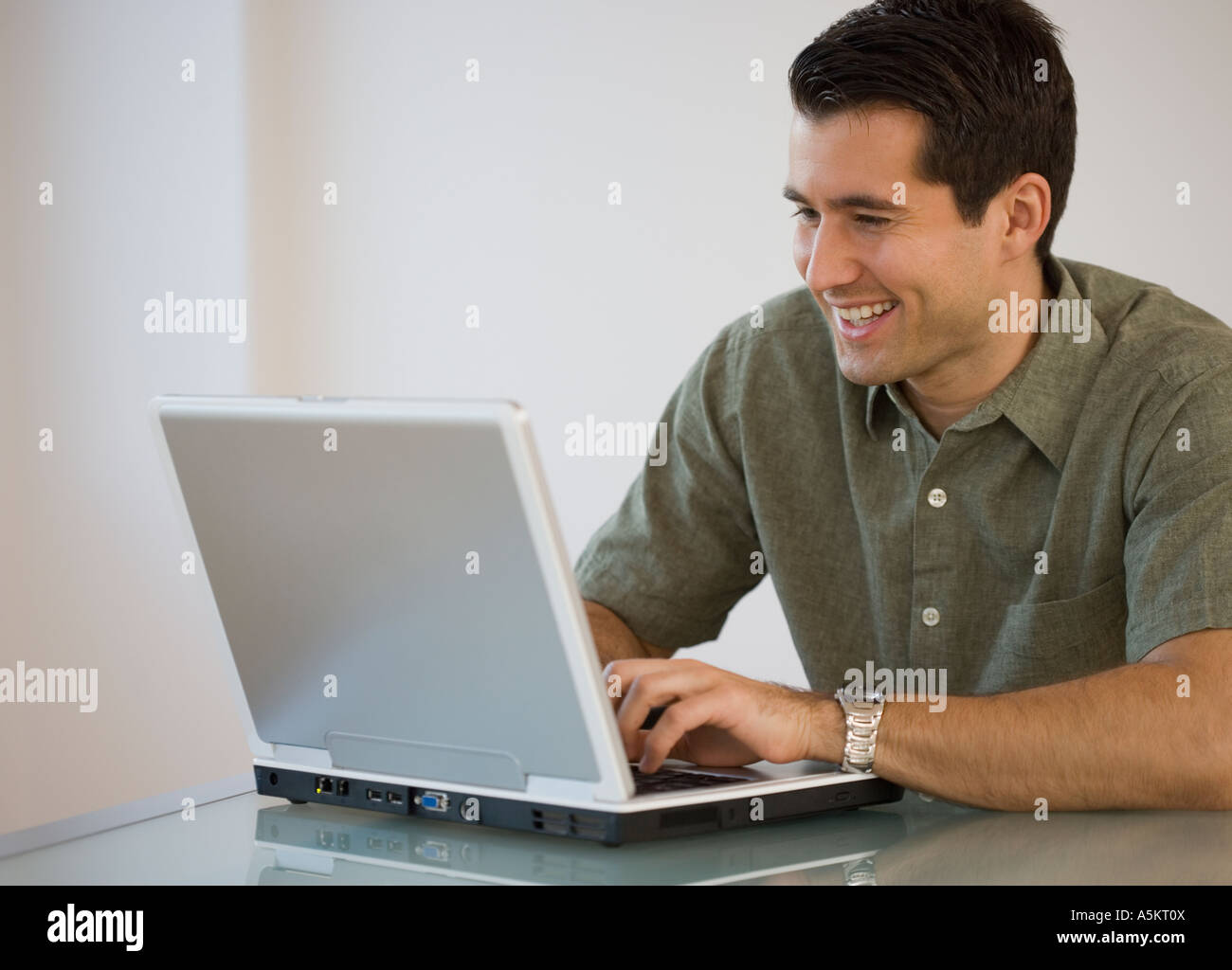 Man typing on laptop Stock Photo - Alamy