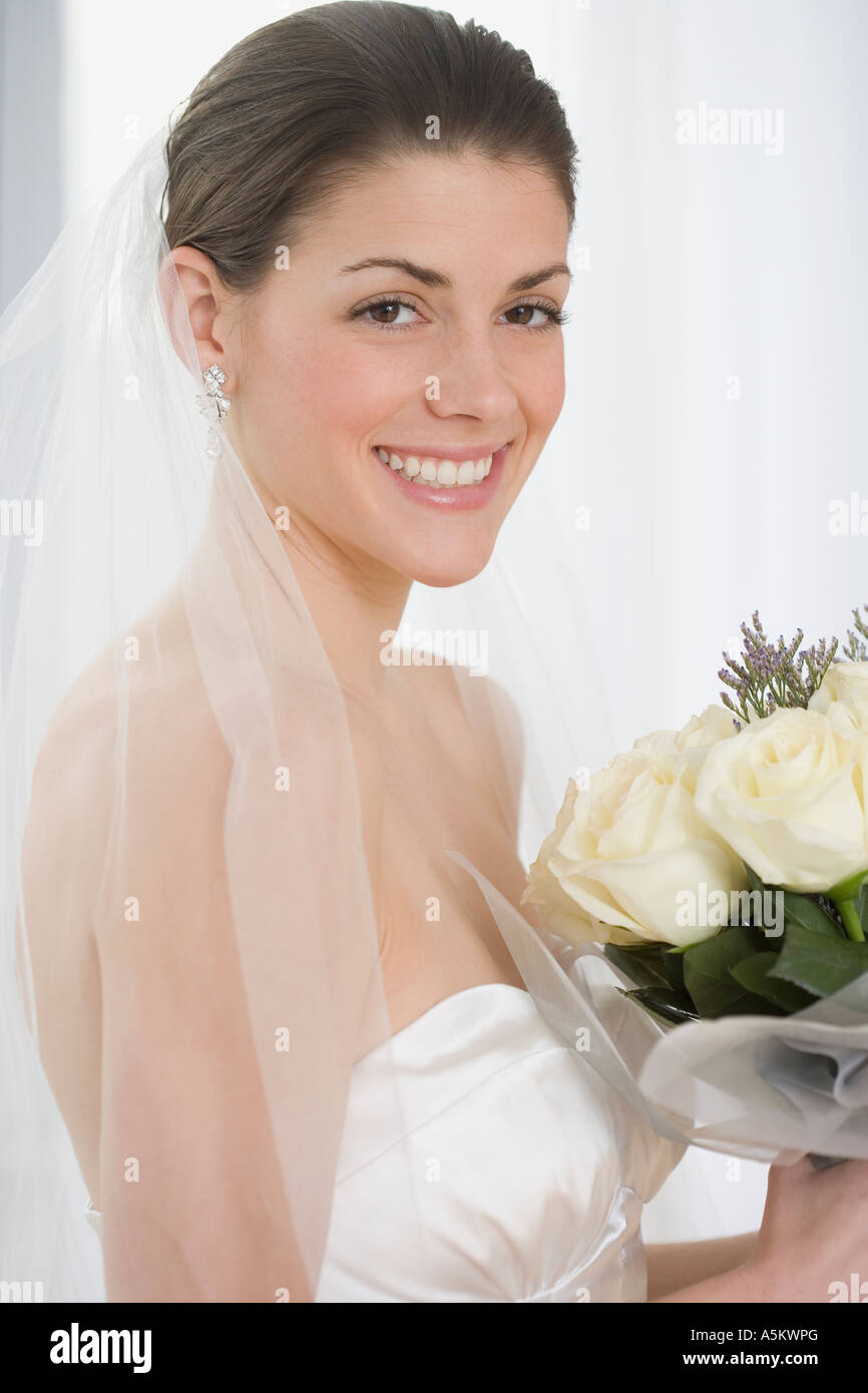 Portrait of bride holding bouquet Stock Photo