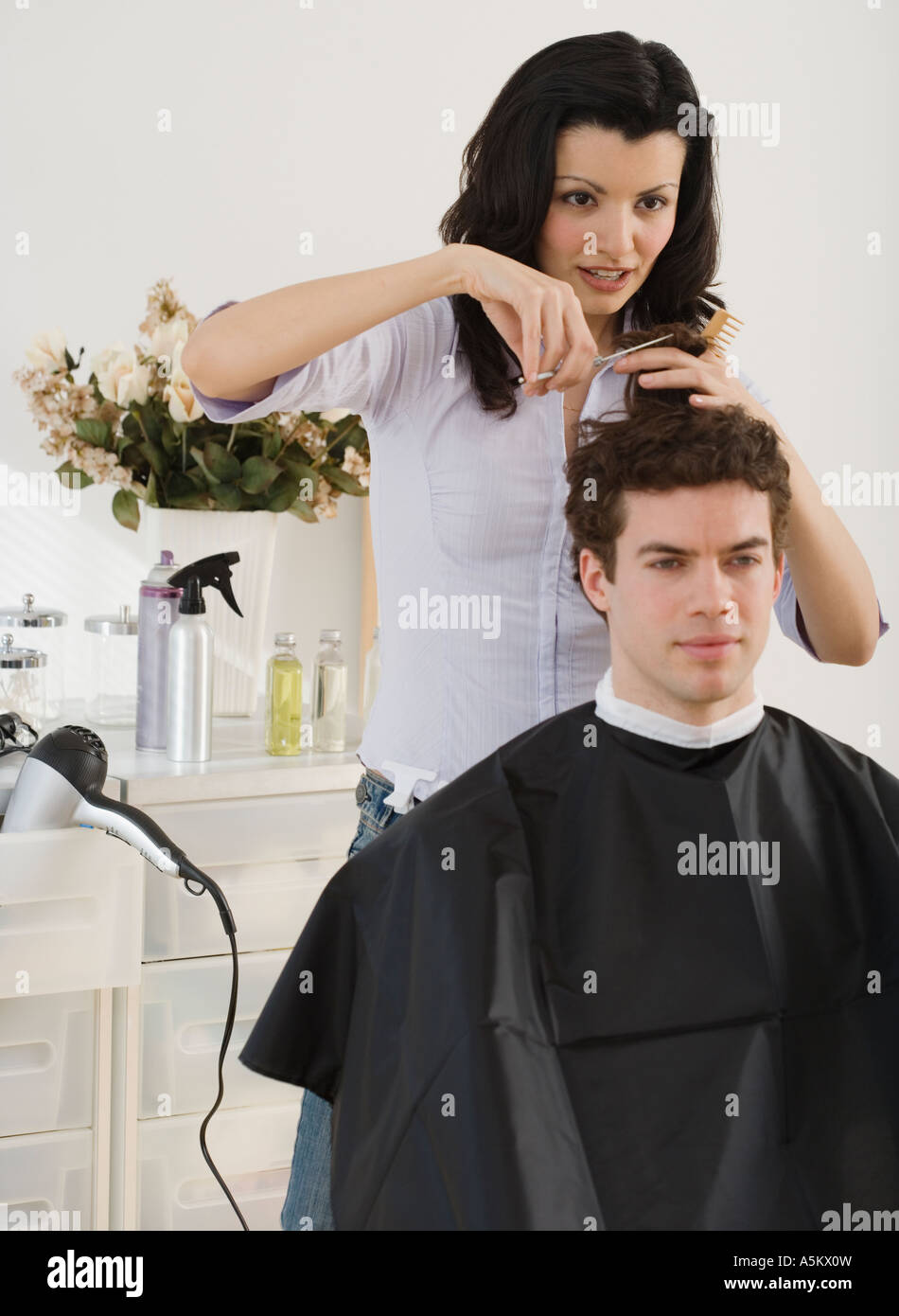 Female hair stylist cutting man s hair Stock Photo - Alamy