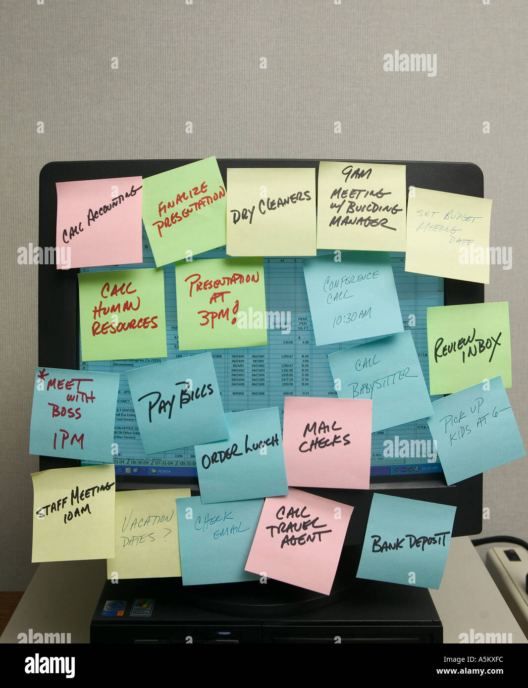 sticky notes on office computer screen Stock Photo - Alamy