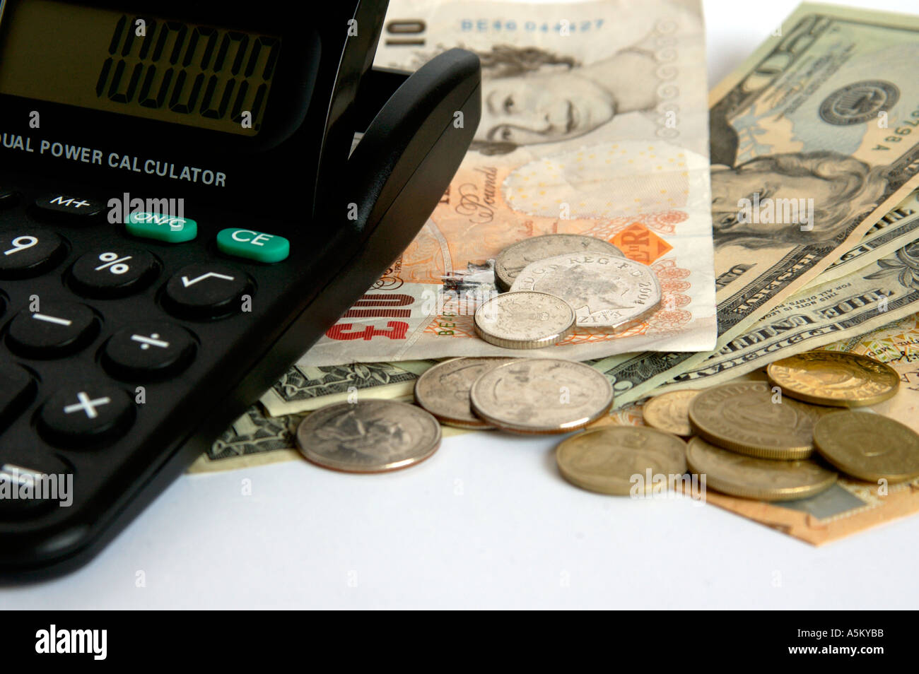 Dollars and pounds with a calculator Stock Photo Alamy