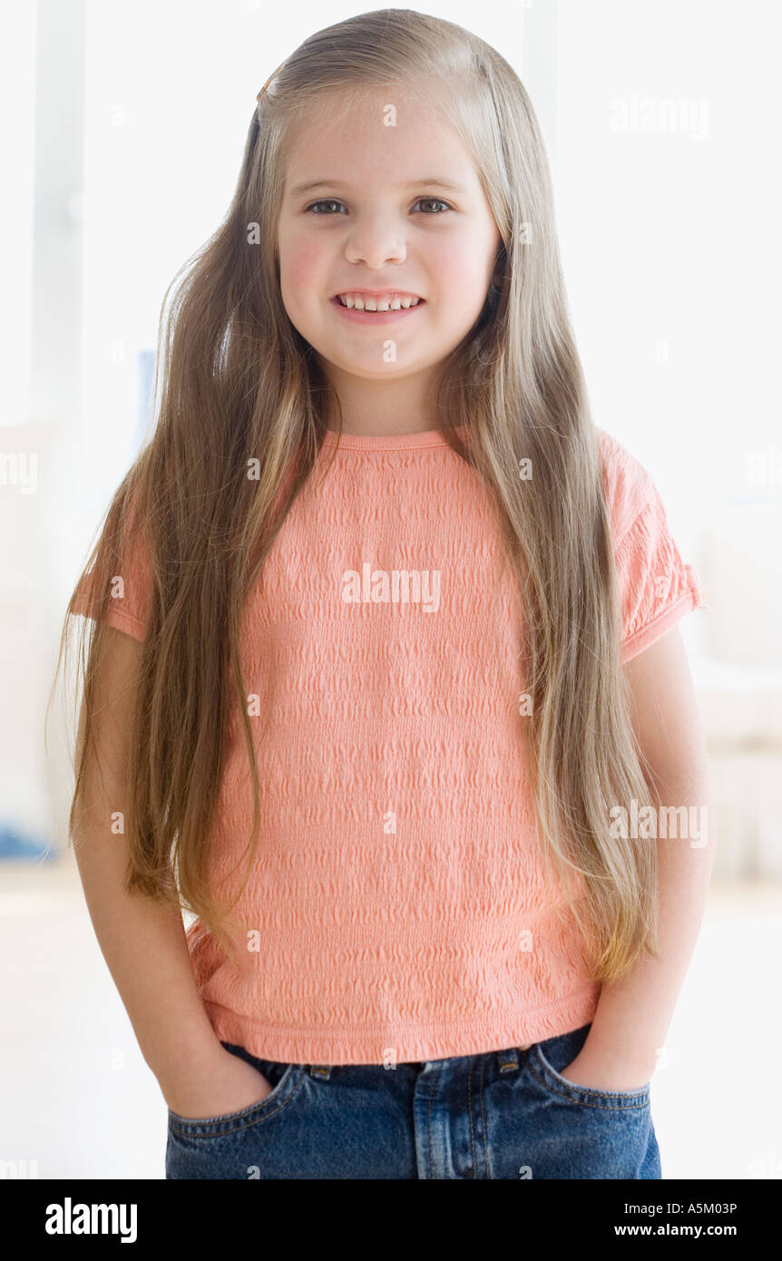 Portrait of girl with hands in pockets Stock Photo - Alamy