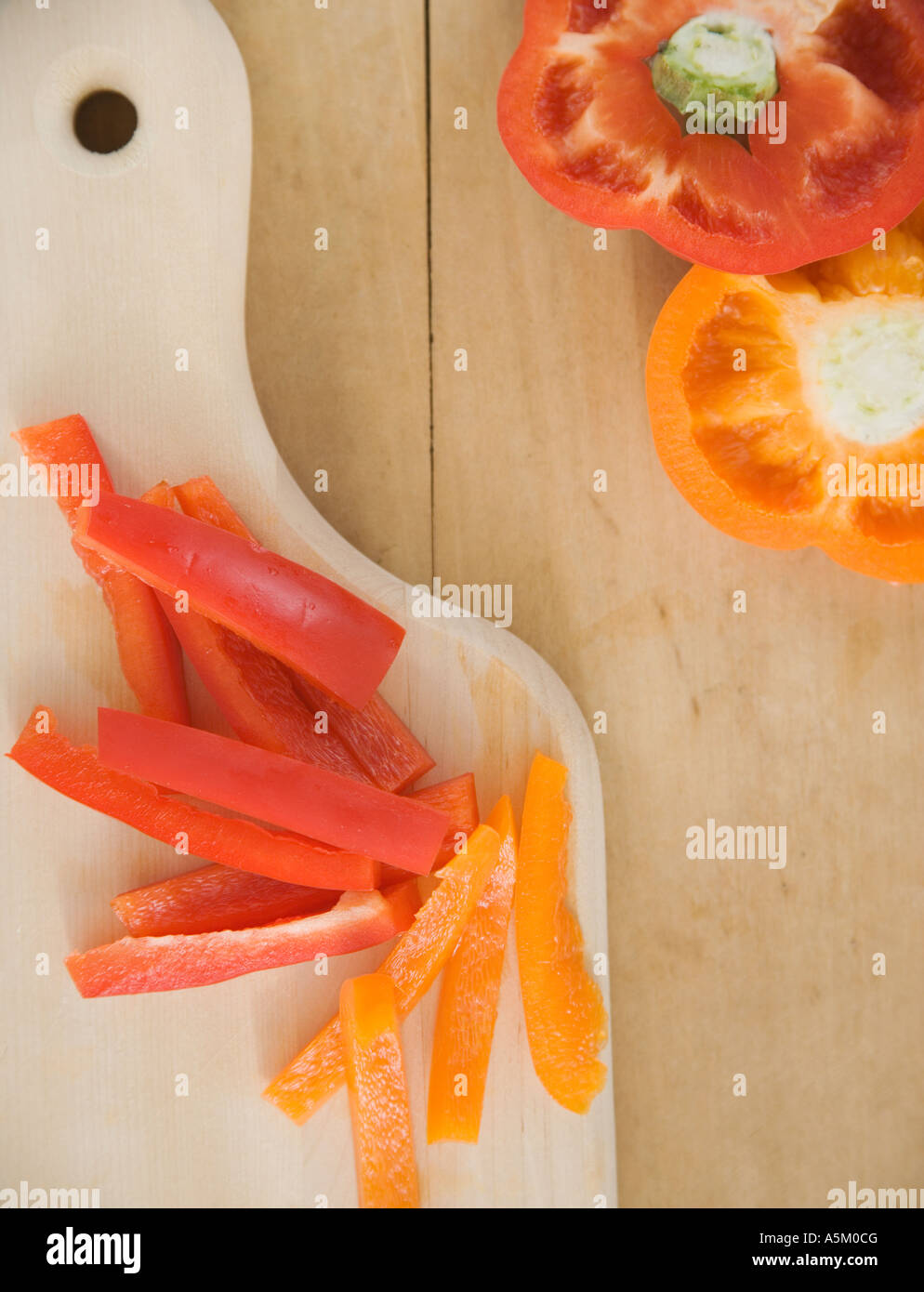 Chopped bell peppers on cutting board Stock Photo