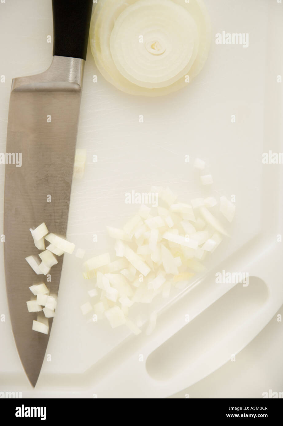 Chopped onions on cutting board Stock Photo