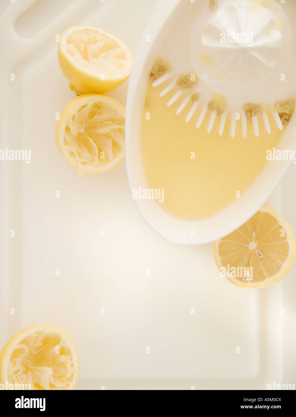 High angle view of oranges and juicer Stock Photo