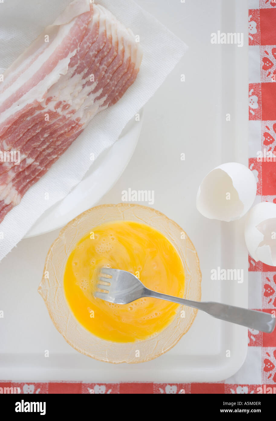 High angle view of raw bacon and eggs Stock Photo