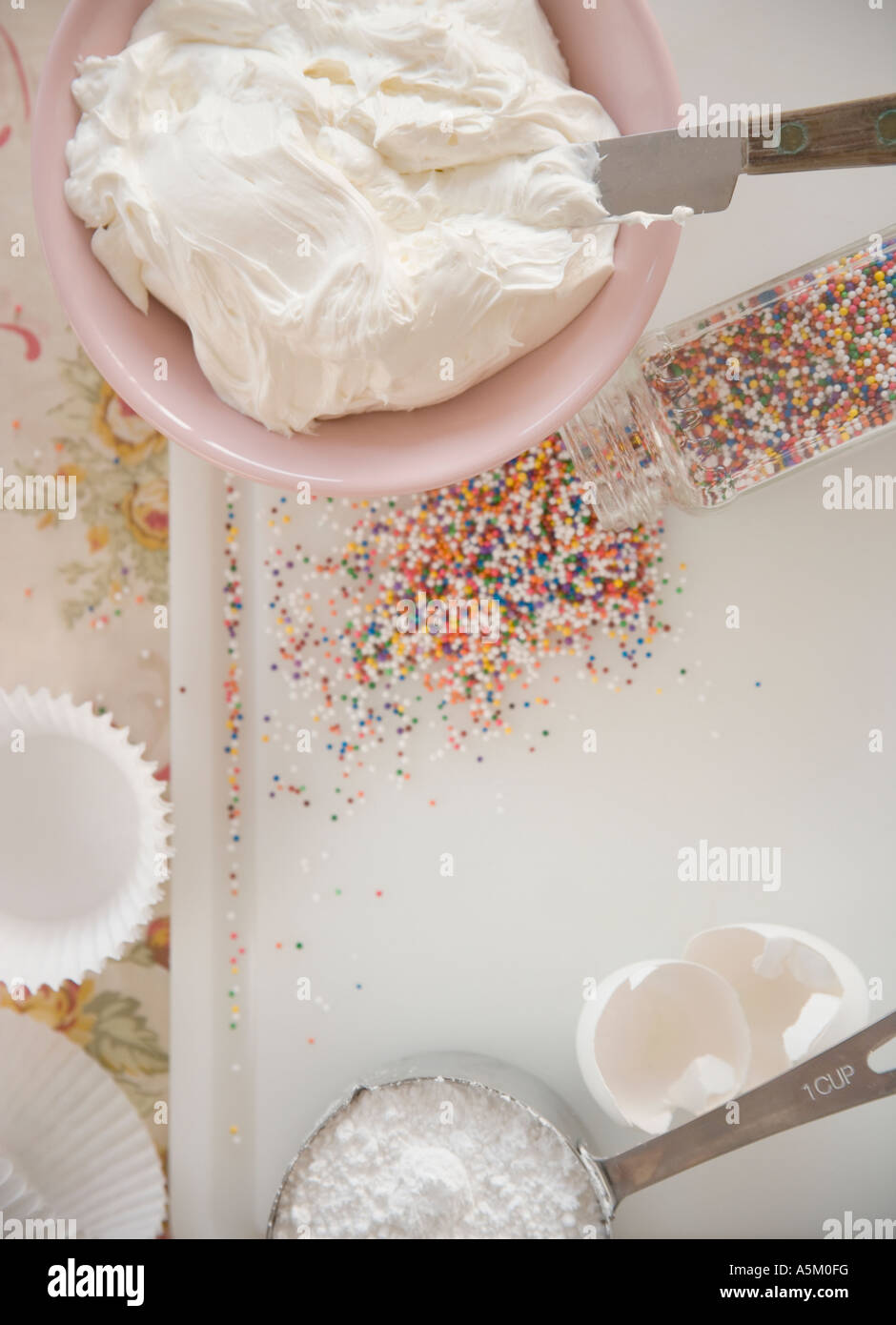 High angle view of frosting and sprinkles Stock Photo