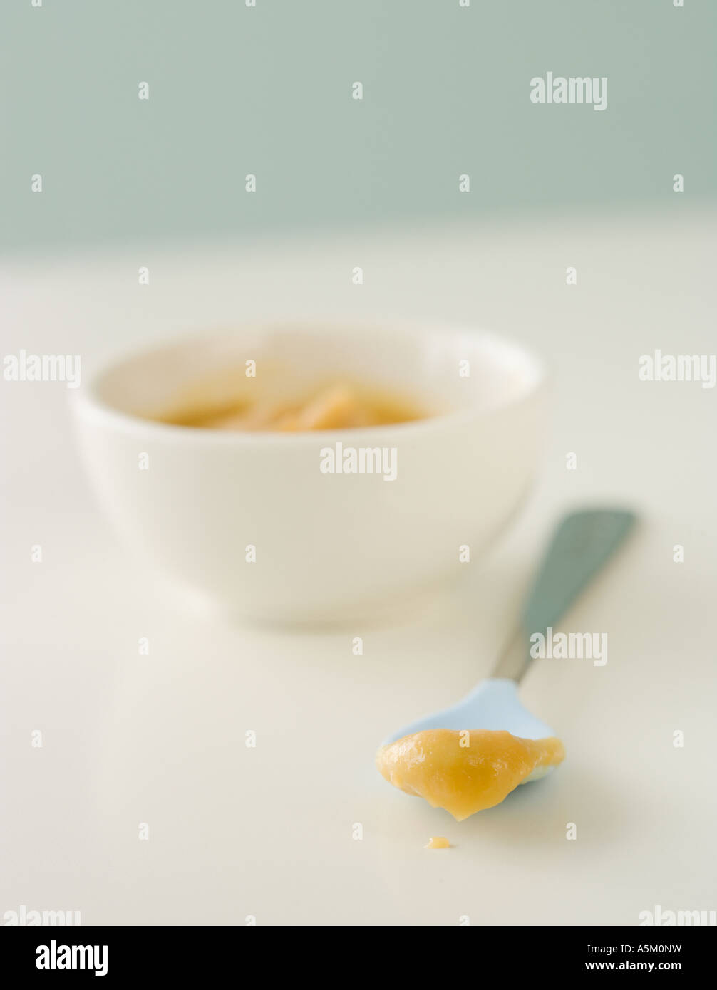 Close up of baby food and spoon Stock Photo