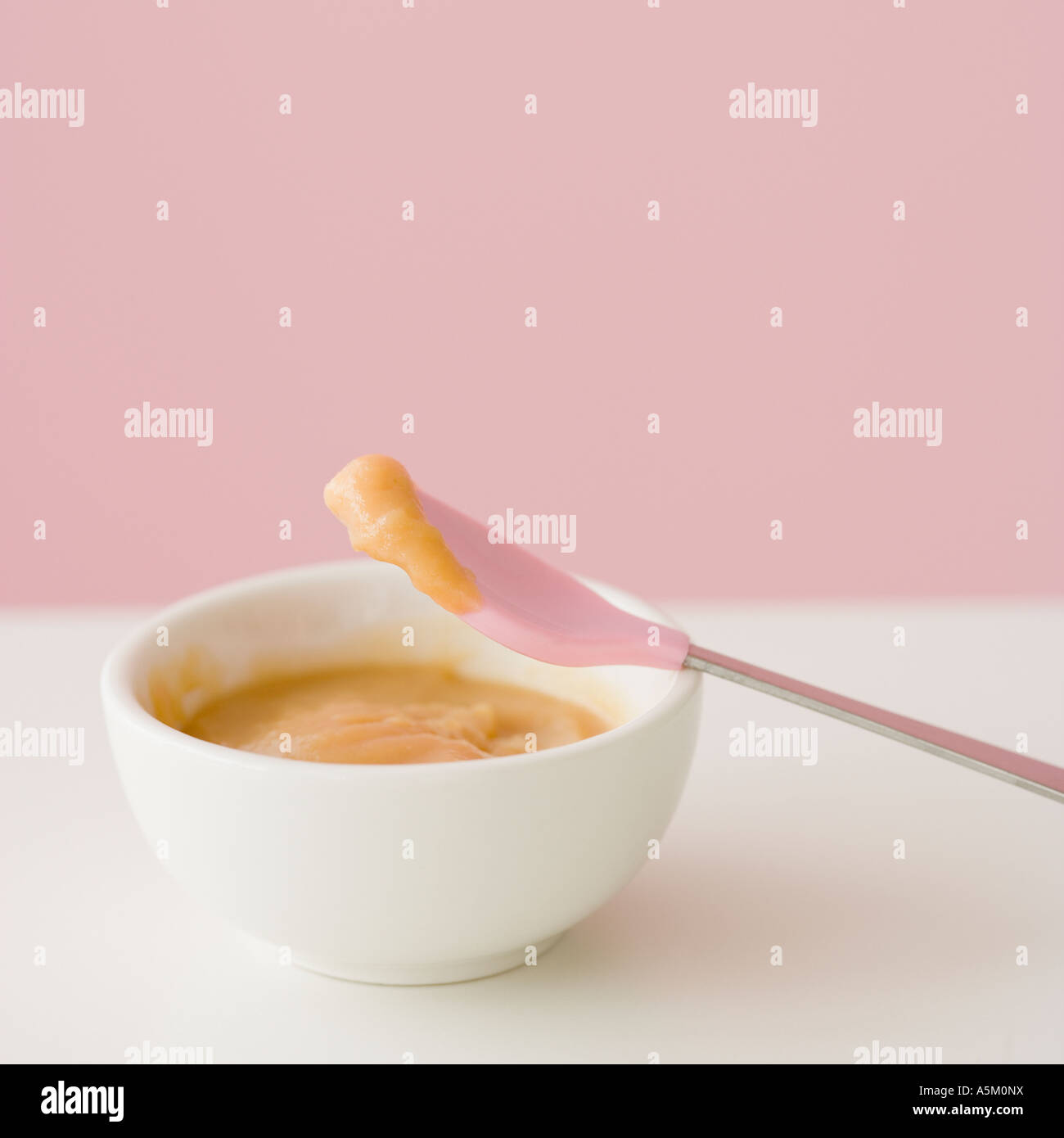 Close up of baby food and spoon Stock Photo