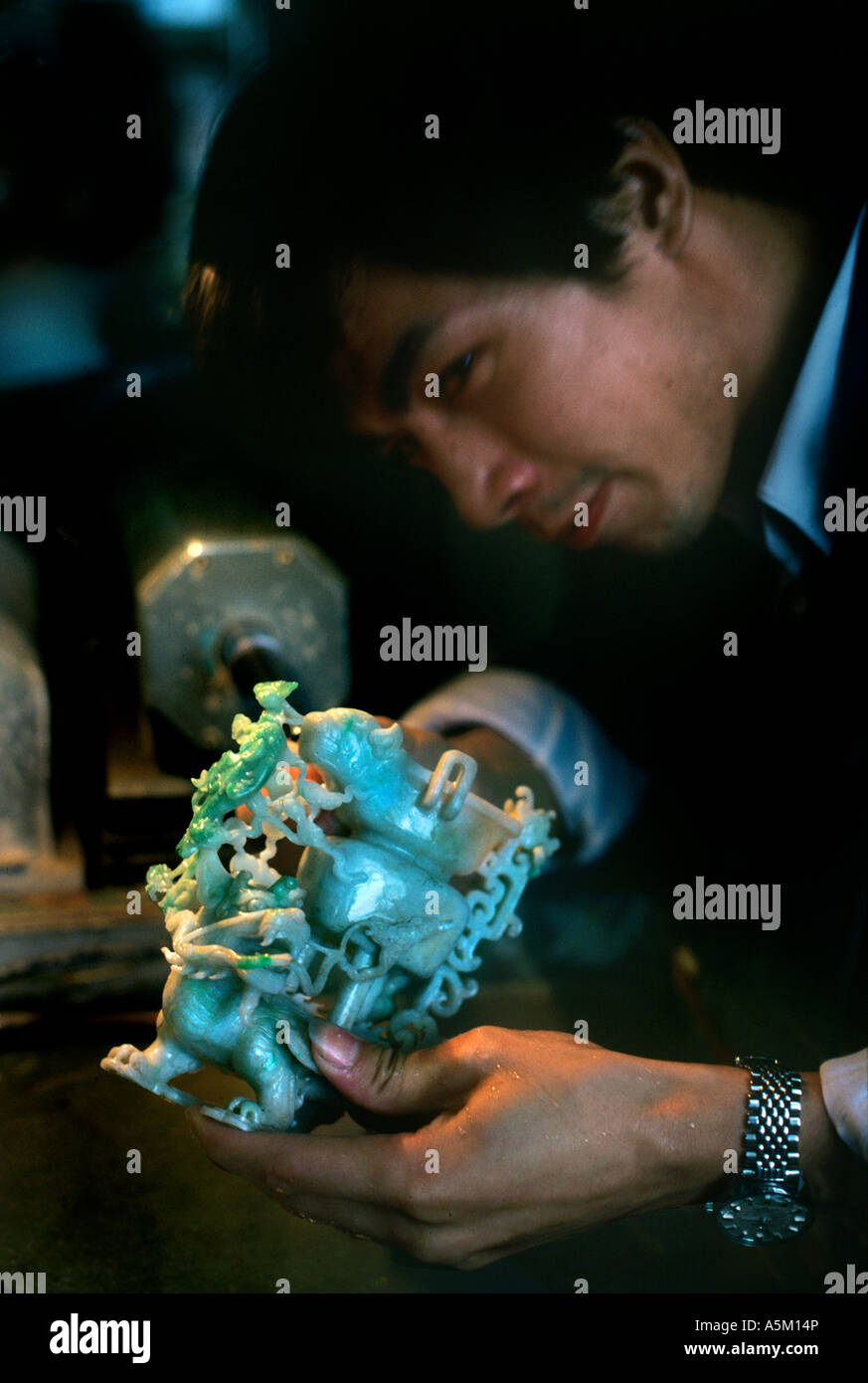 A master jade carver in Shanghai uses both hand tools and a lathe to ...
