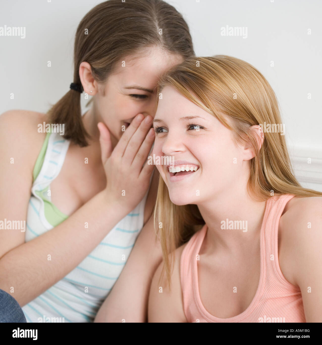 Teenage girl telling secret hi-res stock photography and images - Alamy