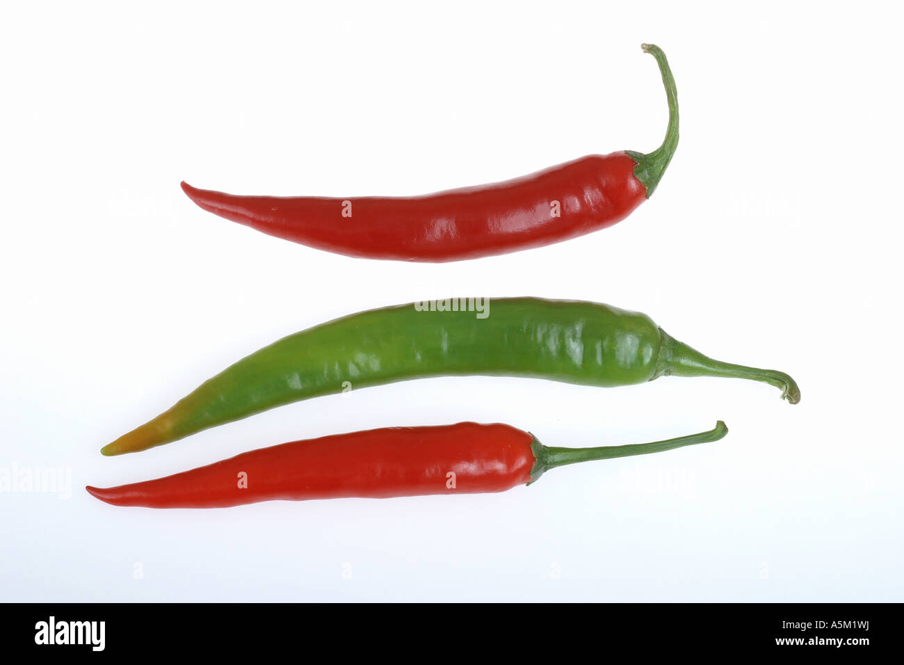 red and greenchilli peppers on a white background Stock Photo