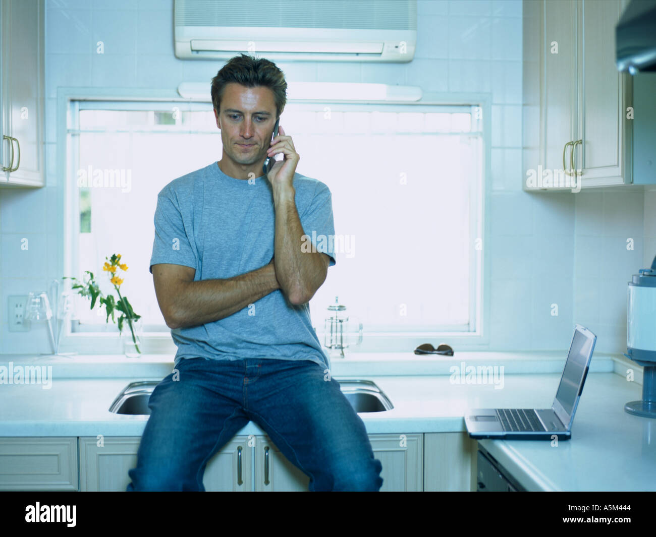 Man sitting at counter hi-res stock photography and images - Alamy