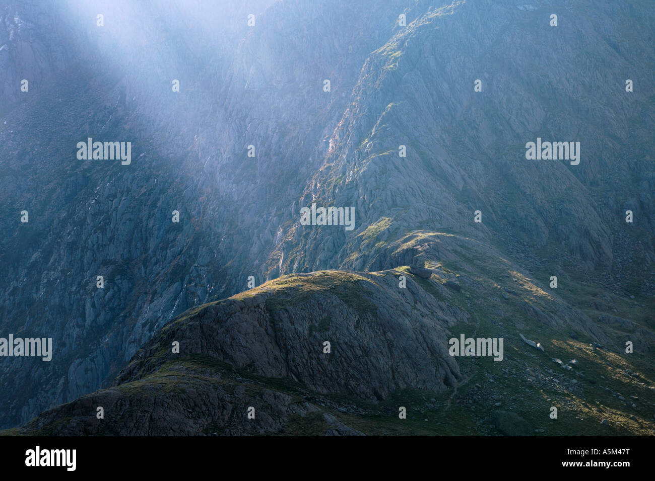 Rays of Light on glacial ridge in Snowdonia National Park Gwynedd Wales Stock Photo