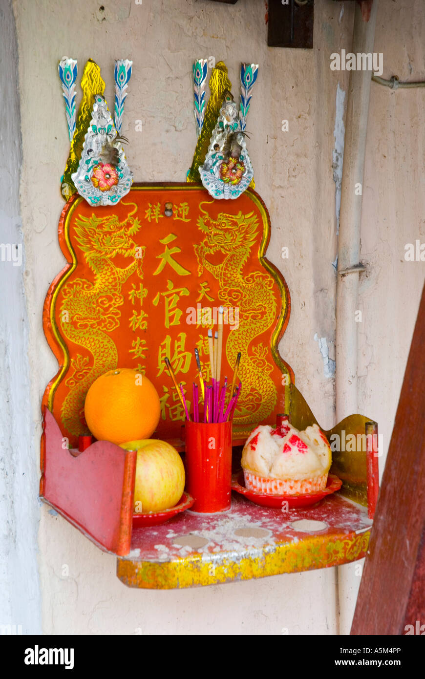 Chinese household shrine with offerings and incense Malaysia Stock Photo Alamy