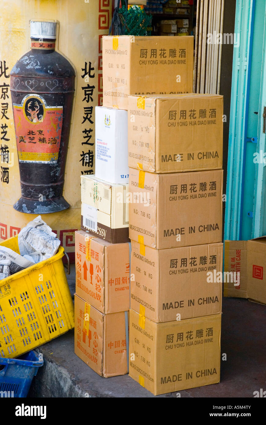 https://c8.alamy.com/comp/A5M4TY/boxes-of-products-made-in-china-stacked-on-the-pavement-outside-a-A5M4TY.jpg