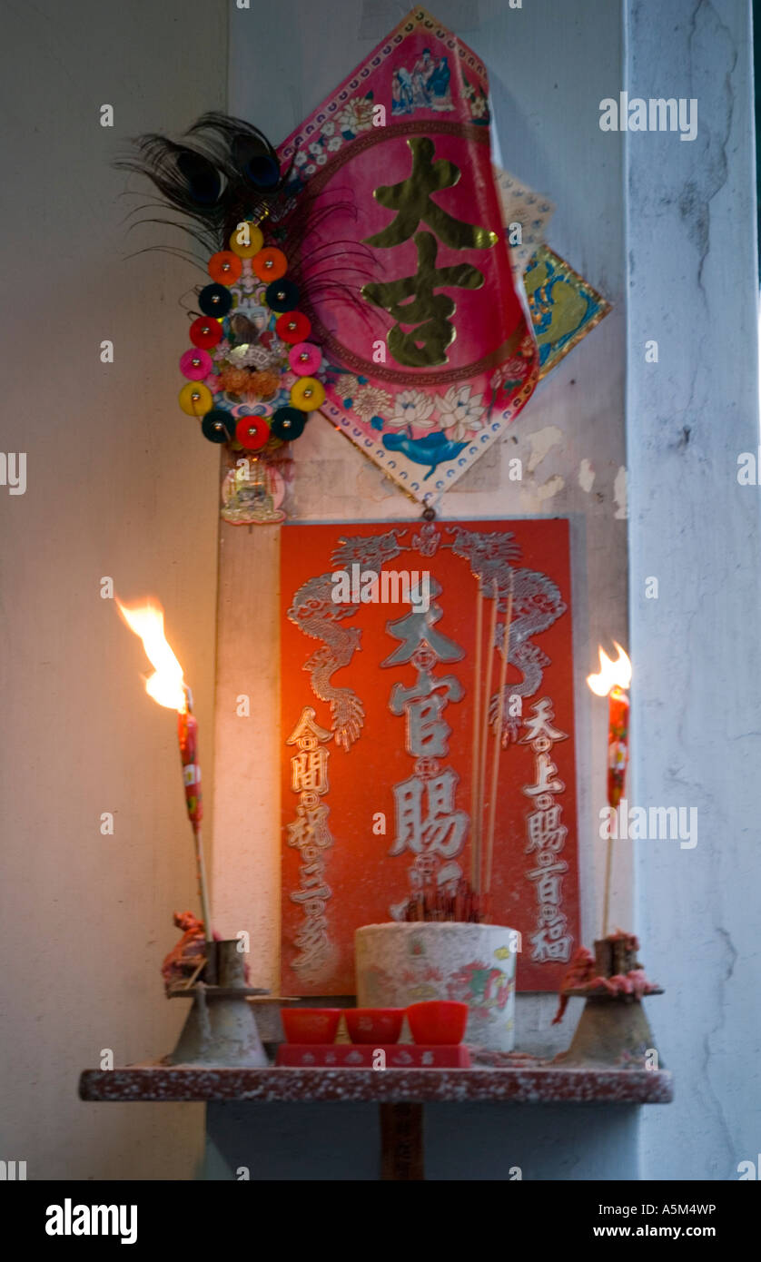 Chinese household shrine with offerings and incense Malaysia Stock