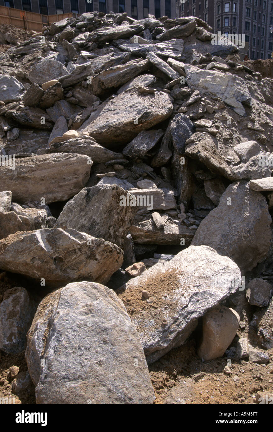 Bedrock broken up by massive rock hammer for foundation hole of Bertelsmann building at 1540