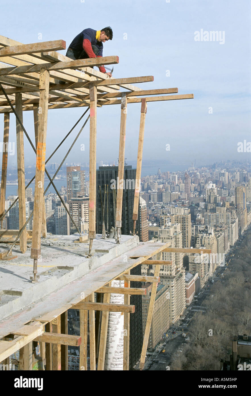 Carpenters build frame to pour reinforced concrete floors for ...
