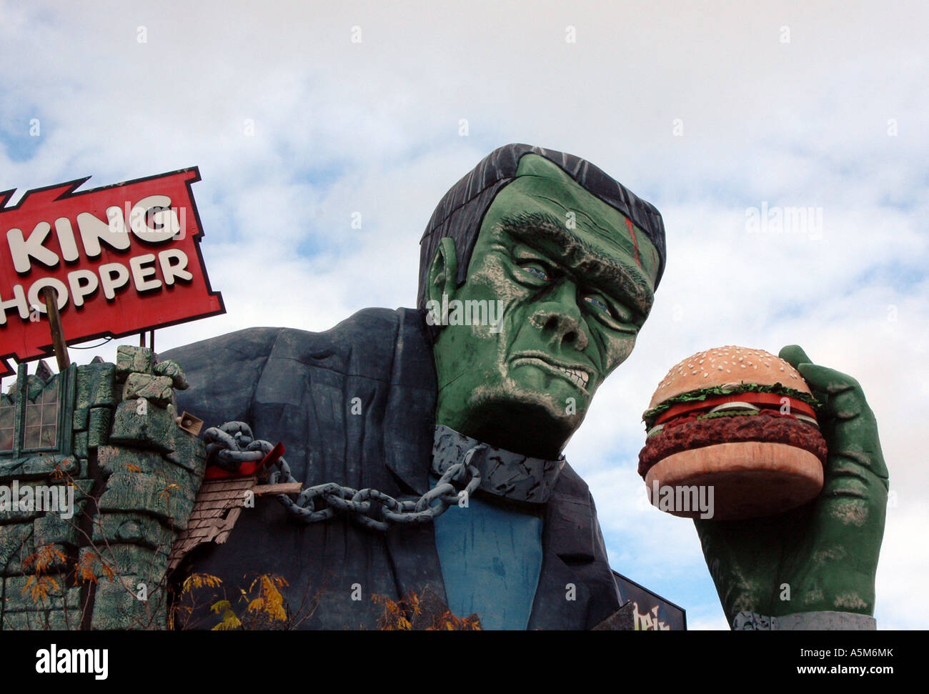 Frankenstein character model holding a beef burger, Burger King Stock Photo