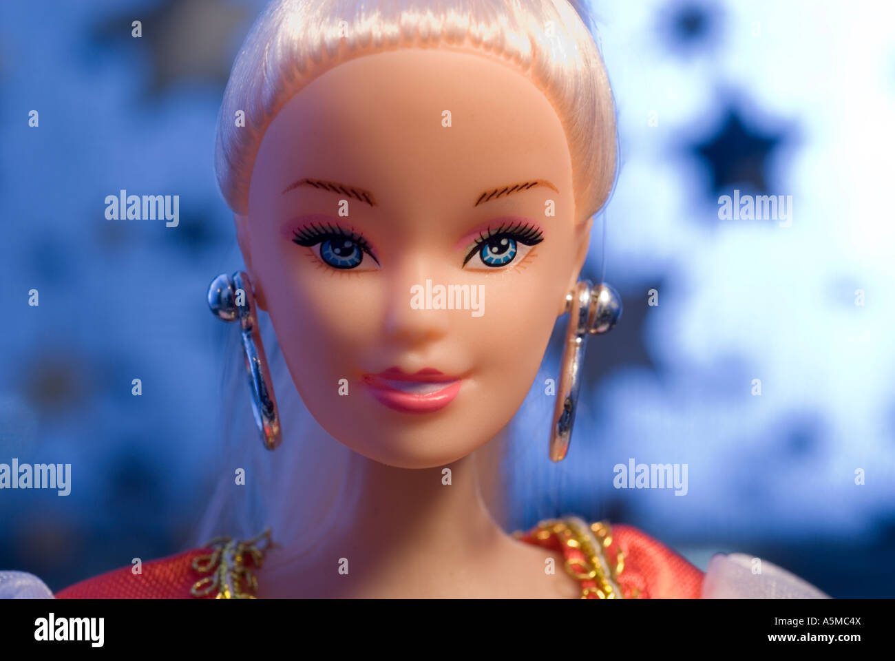 dolls face in front of starry background Stock Photo