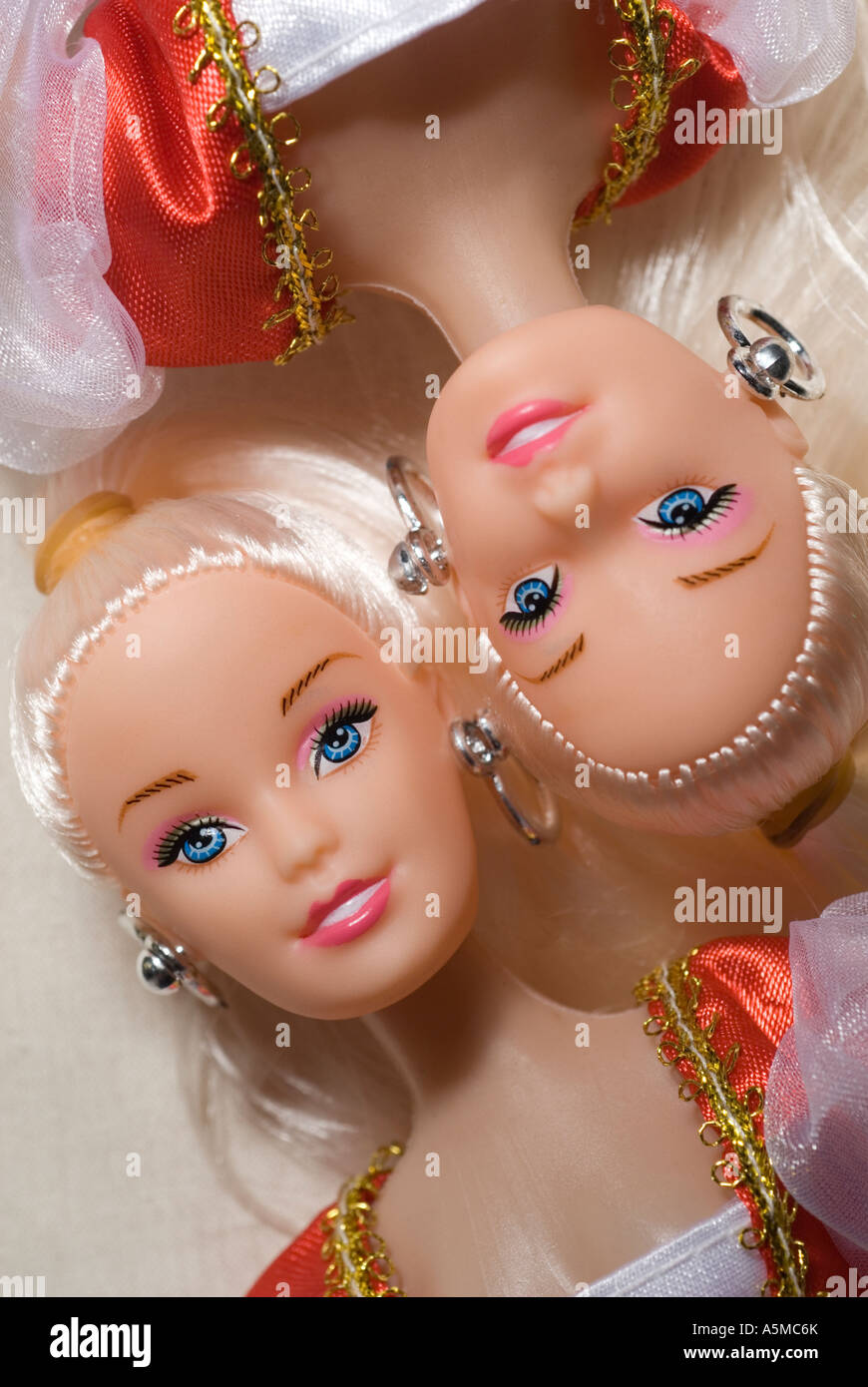 birdseye view of two identical dolls vertical Stock Photo