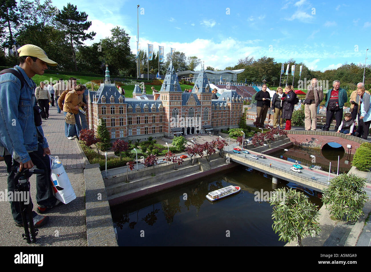 Tourists seeing small miniature of Amsterdam city at Madurodam Den Haag Netherlands Holland Europe EU - raj 98770 Stock Photo